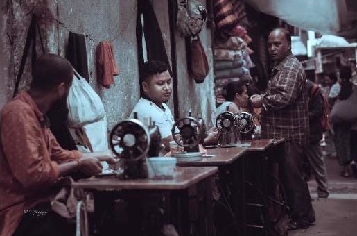 Iewduh has dedicated streets to the wares and services that its vendors offer. Like this one allocated for tailoring services. Image Source: Khyrshan Khongthaw