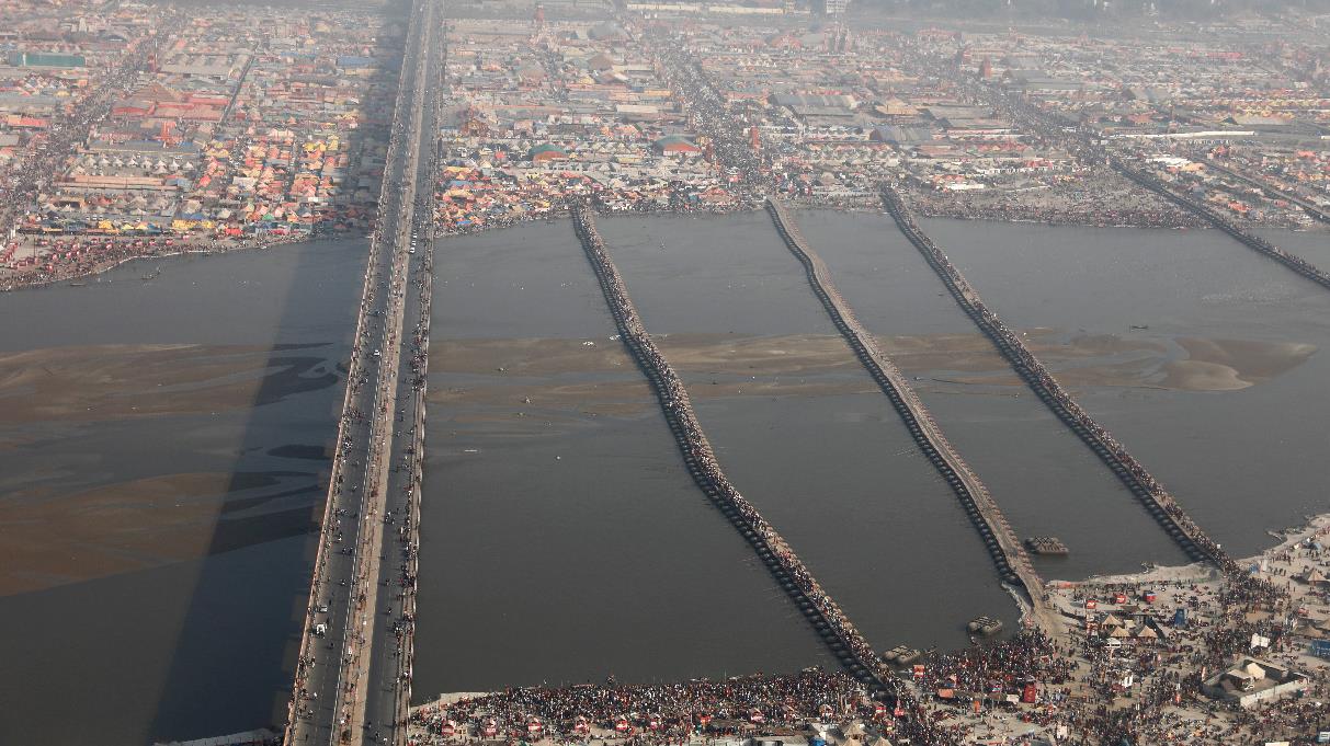 Pontoon bridges connecting the river banks and people at Prayag Kumbh, 2019. 22 such pontoon bridges were constructed to get people, animals and vehicles across rivers. 