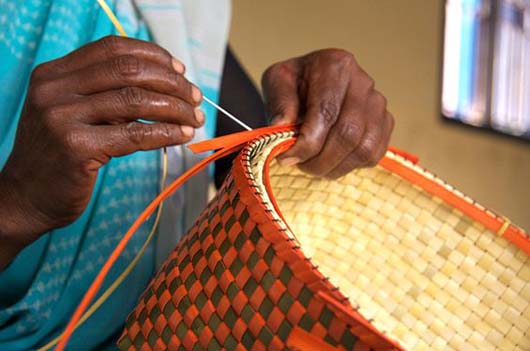 Baskets being woven out of palm-leaves